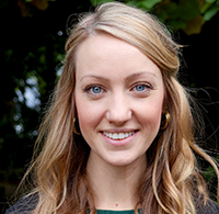 Jenny Wilkinson Headshot in front of garden